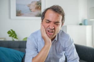 bigstock One Man Suffering Toothache Si 430788989